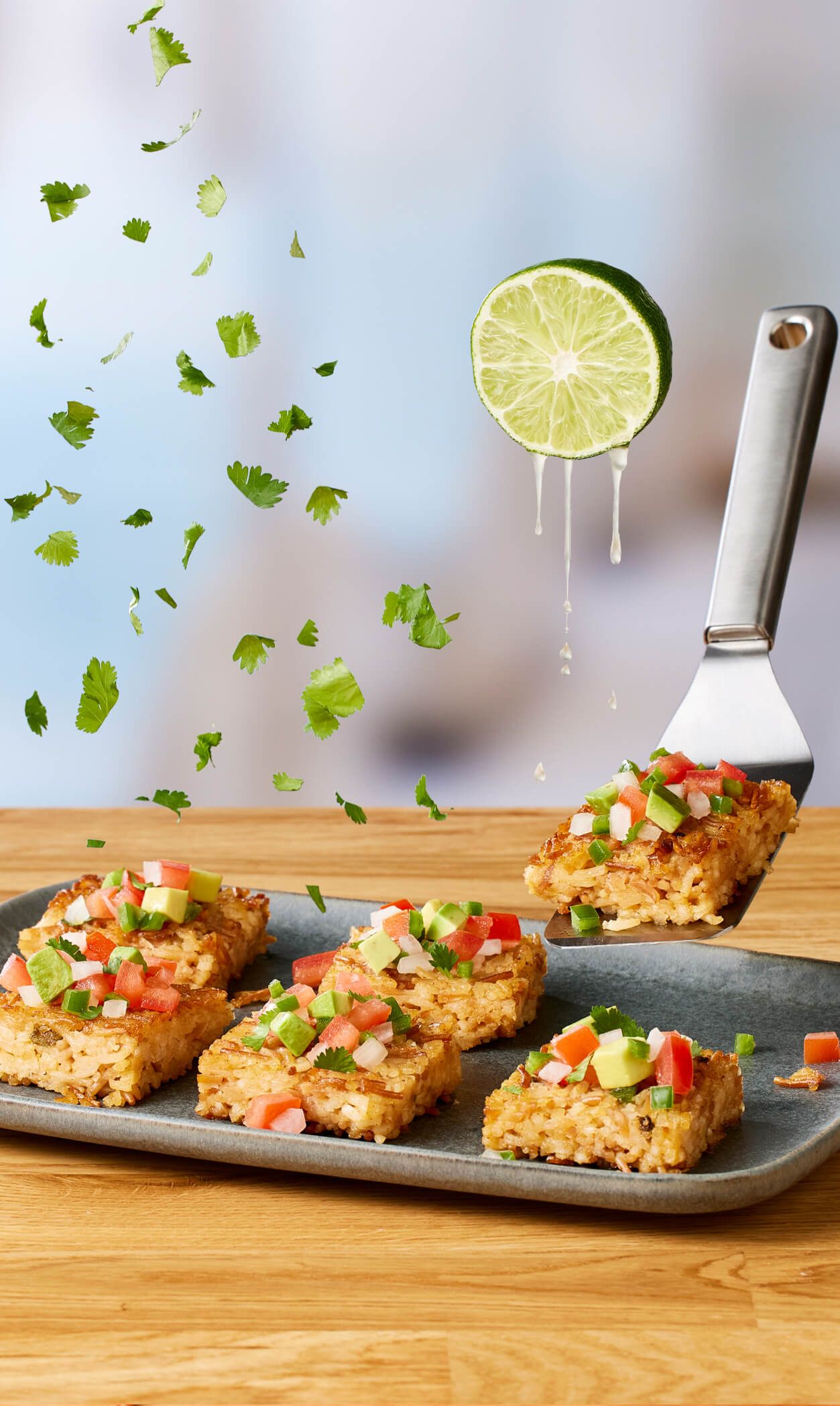 Crispy Rice-a-Roni squares with fresh toppings and lime.