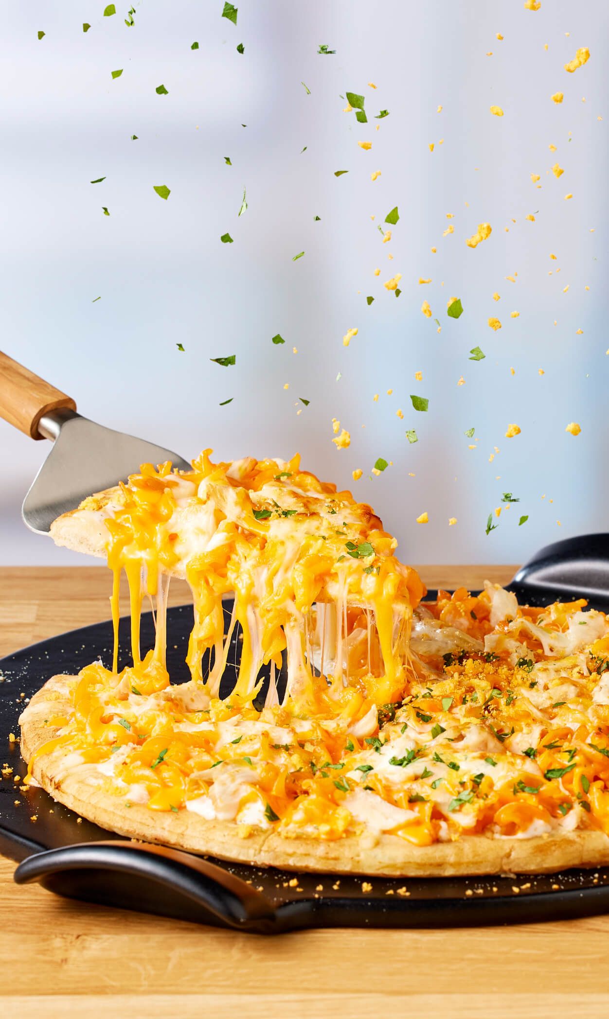 Slice of Cheetos Mac n’ Cheese Pizza with toppings.